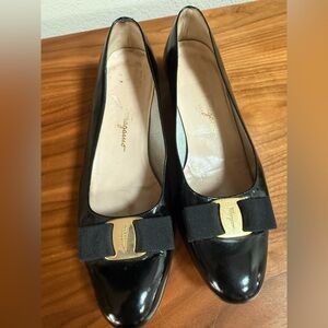 Salvatore Ferragamo Black with Gold Bow Accents